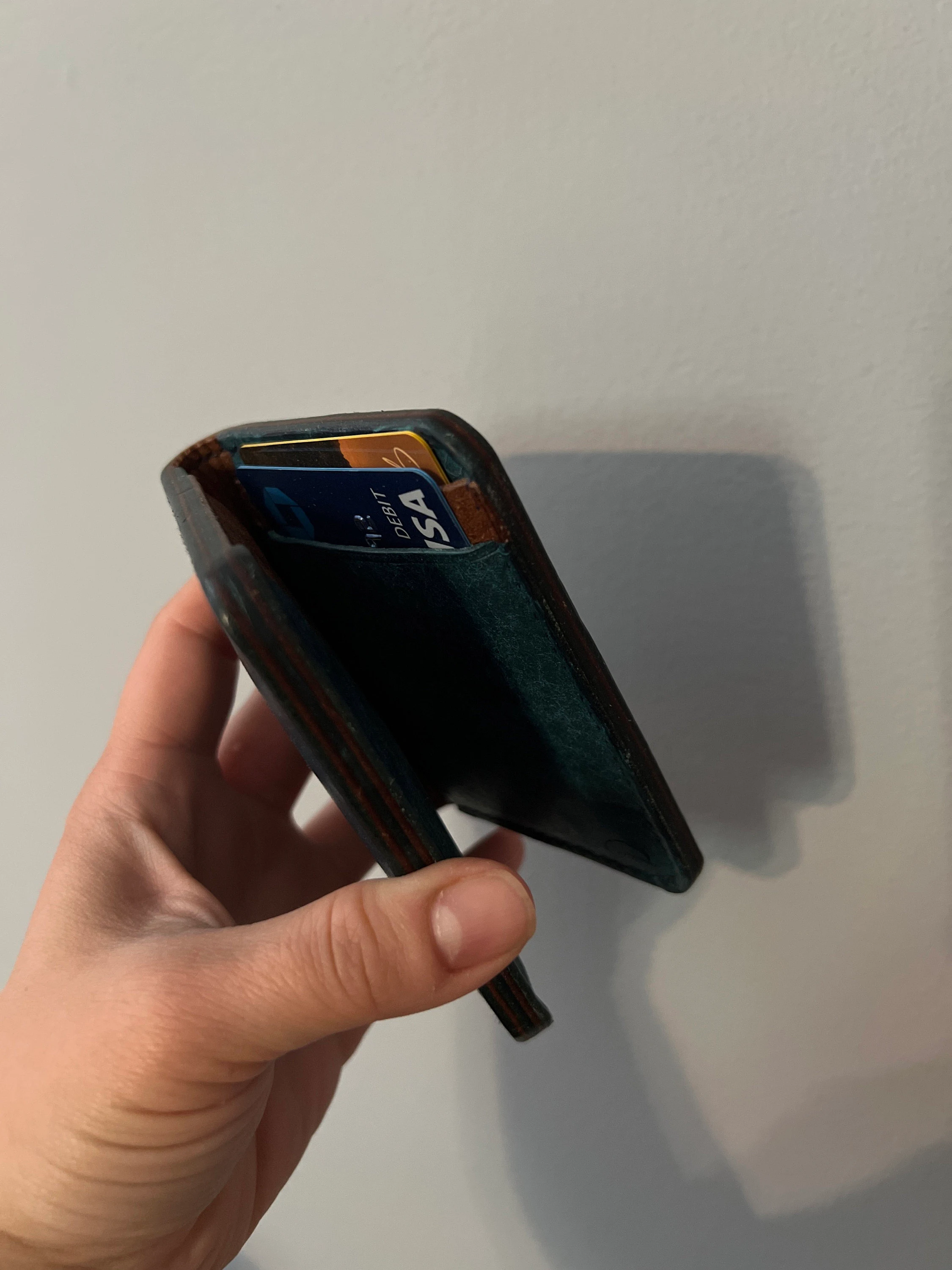 Customer photo submitted with rox11492's May 2022 Etsy review showing the wallet in hand with cards inserted.